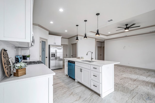 kitchen featuring pendant lighting, sink, appliances with stainless steel finishes, a kitchen island with sink, and white cabinetry