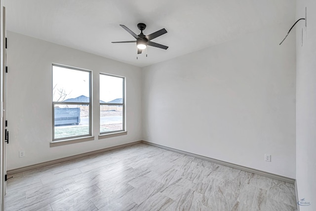 unfurnished room featuring ceiling fan