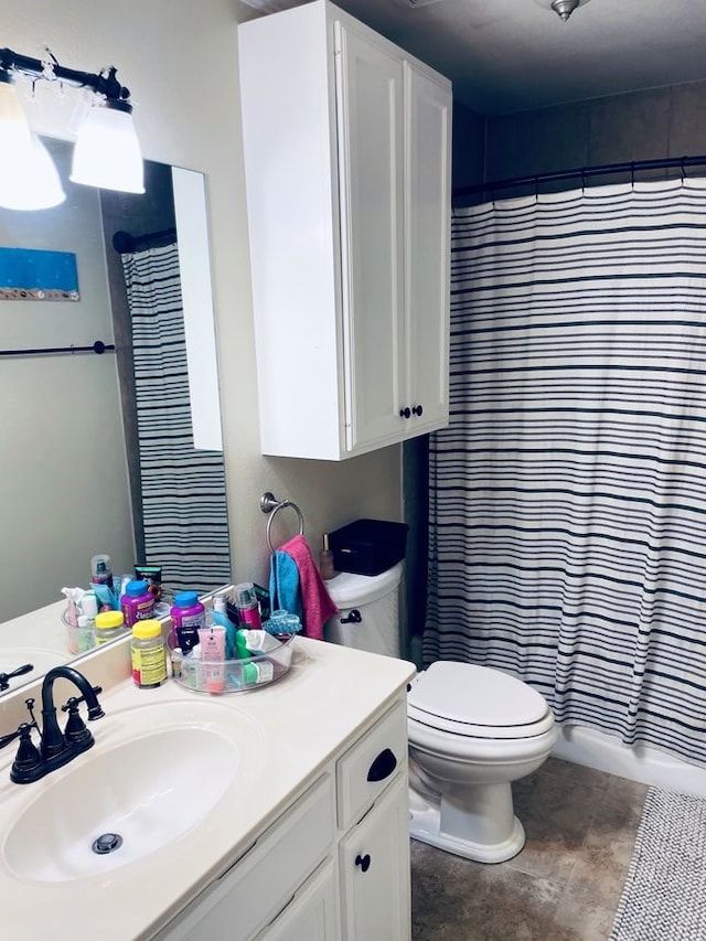 full bath with curtained shower, tile patterned flooring, vanity, and toilet