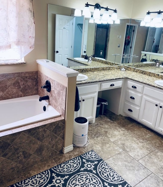 bathroom featuring double vanity, a sink, and a bath