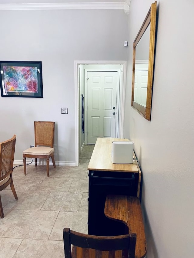 corridor featuring crown molding and baseboards