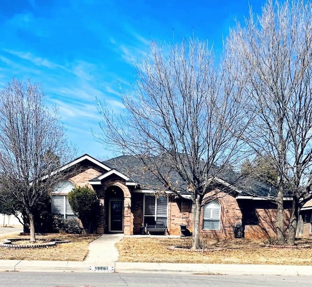 single story home with brick siding