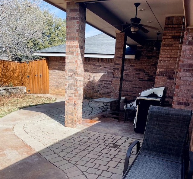 view of patio / terrace featuring ceiling fan, grilling area, and fence