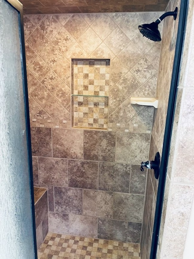 full bath with a shower stall