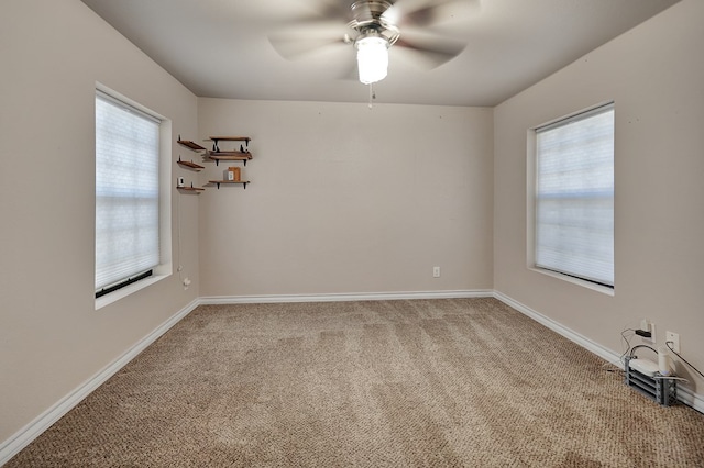 1901 College Ave, Midland, TX 79701 - unfurnished room featuring a ceiling fan, healthy amount of natural light, light carpet, and baseboards