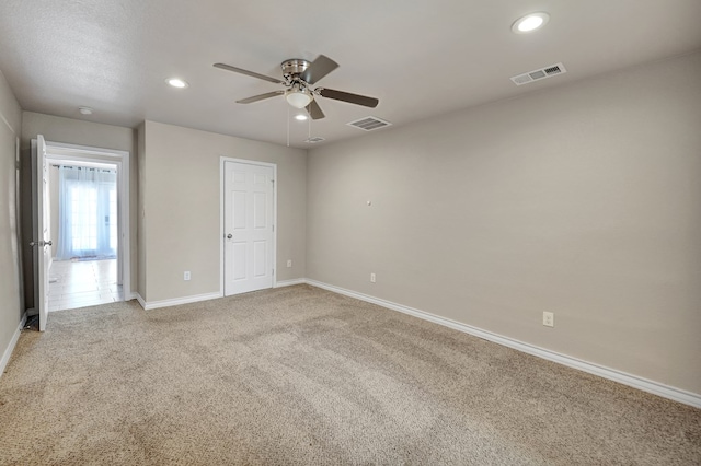 1901 College Ave, Midland, TX 79701 - unfurnished bedroom with light carpet, baseboards, recessed lighting, and a ceiling fan