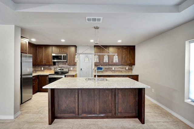 1901 College Ave, Midland, TX 79701 - kitchen with stainless steel appliances, a sink, backsplash, baseboards, and recessed lighting