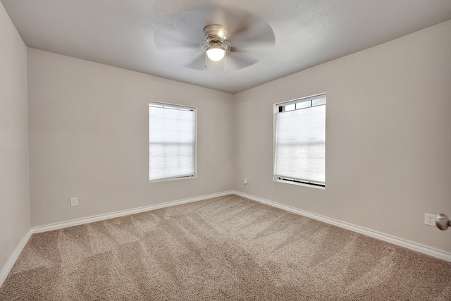 1901 College Ave, Midland, TX 79701 - spare room featuring carpet, a ceiling fan, and baseboards
