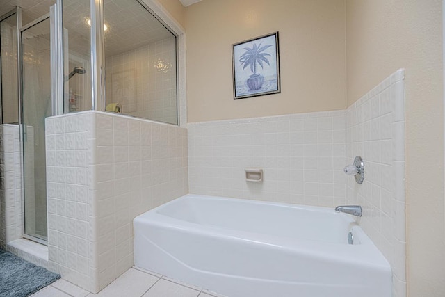 2807 Ann Dr, Midland, TX 79705 - full bathroom featuring a stall shower, a bath, and tile patterned floors
