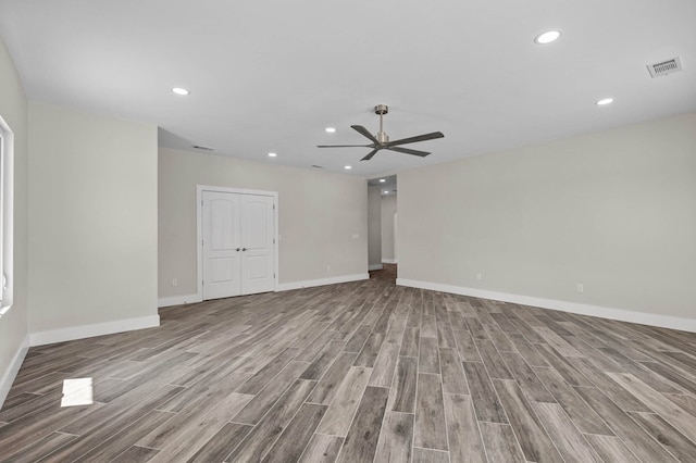 spare room with ceiling fan and light hardwood / wood-style flooring