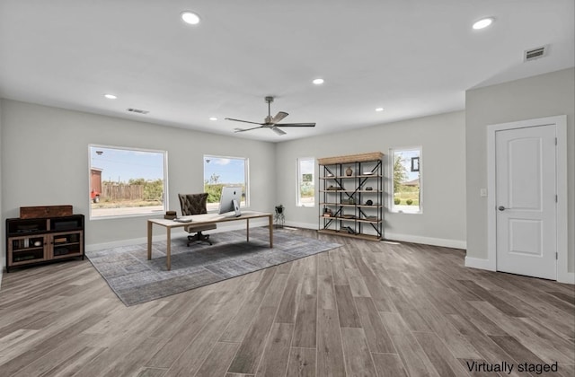 office space featuring ceiling fan and light wood-type flooring