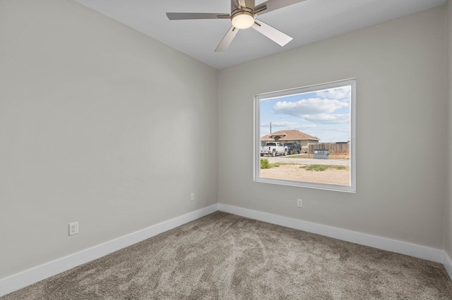 unfurnished room featuring ceiling fan and carpet floors