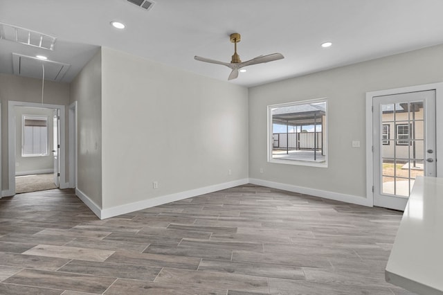 empty room with a wealth of natural light and ceiling fan