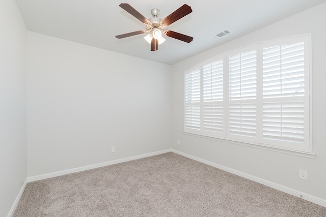 carpeted empty room with ceiling fan