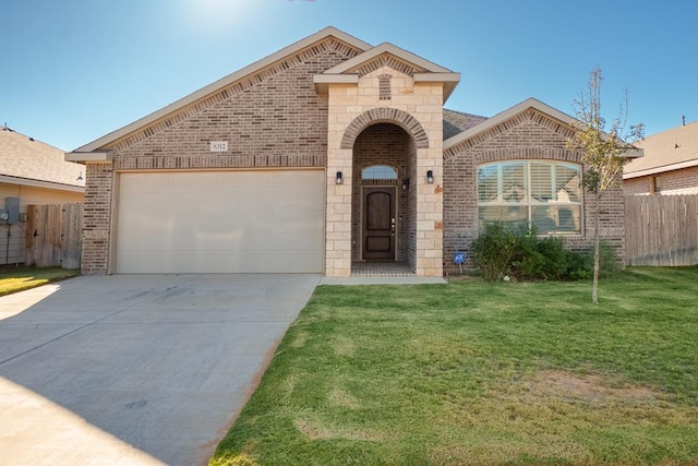 view of front facade featuring a garage and a front lawn