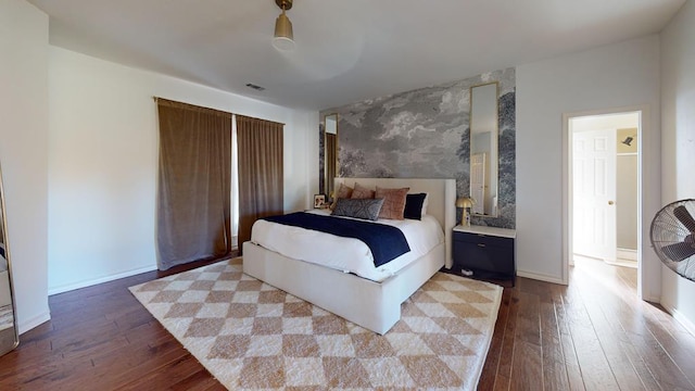 bedroom featuring hardwood / wood-style flooring and ceiling fan