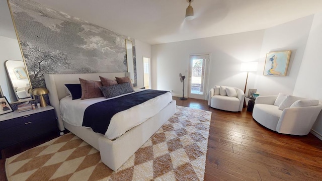 bedroom featuring hardwood / wood-style flooring and ceiling fan