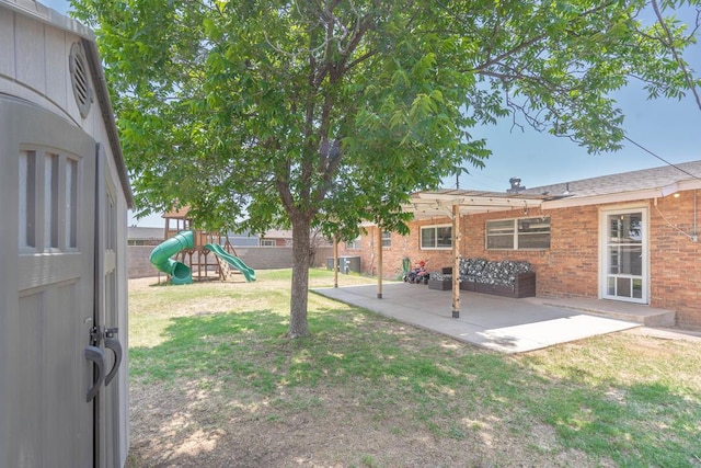 702 Dellwood St, Midland, TX 79701 - view of yard featuring a playground, a patio area, a pergola, and central AC unit
