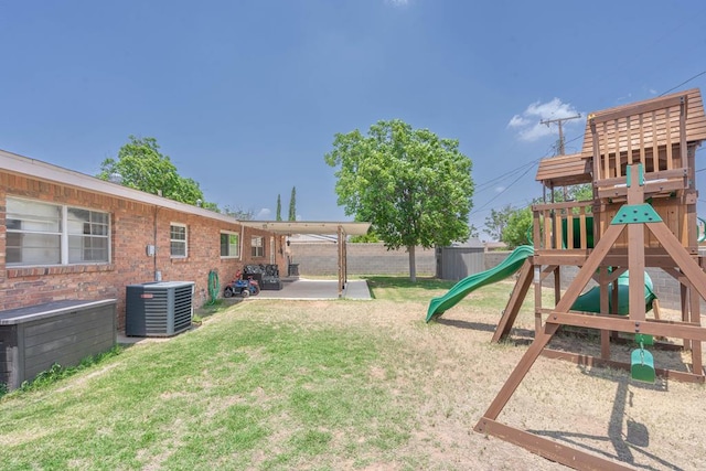 702 Dellwood St, Midland, TX 79701 - view of yard with cooling unit, a playground, and a patio area