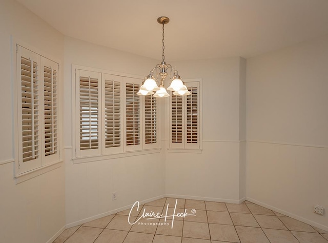 3307 Stanolind Ct, Midland, TX 79707 - unfurnished dining area featuring a chandelier and tile patterned flooring