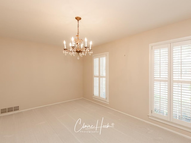 3307 Stanolind Ct, Midland, TX 79707 - empty room with a chandelier and light colored carpet
