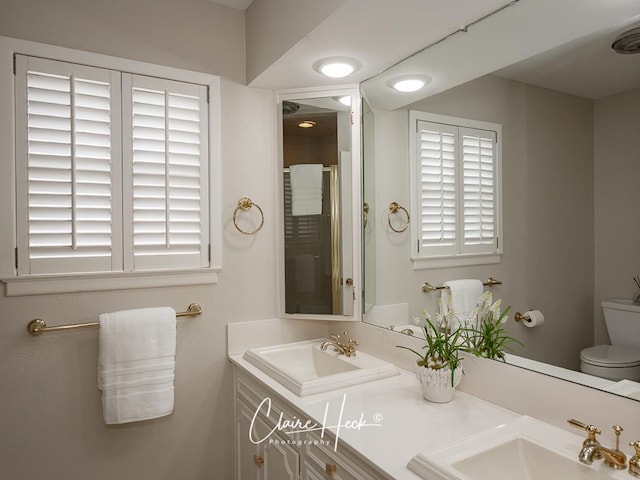 3307 Stanolind Ct, Midland, TX 79707 - bathroom with double vanity and an enclosed shower