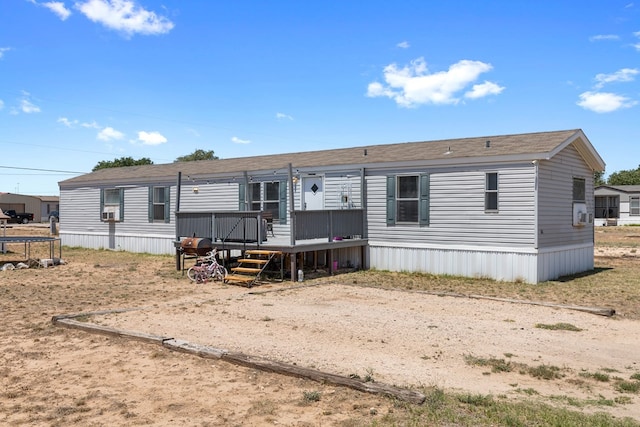 rear view of property with a deck