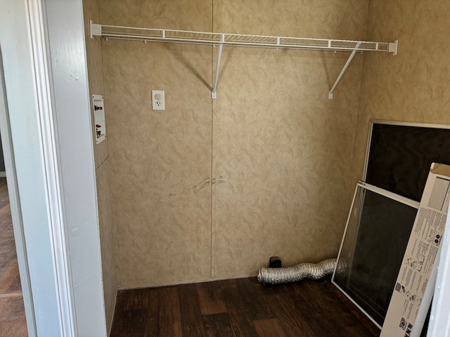 laundry area featuring laundry area, washer hookup, wood finished floors, and electric dryer hookup