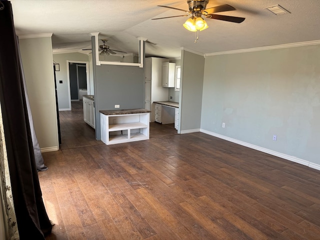 unfurnished living room with ornamental molding, dark wood finished floors, and visible vents