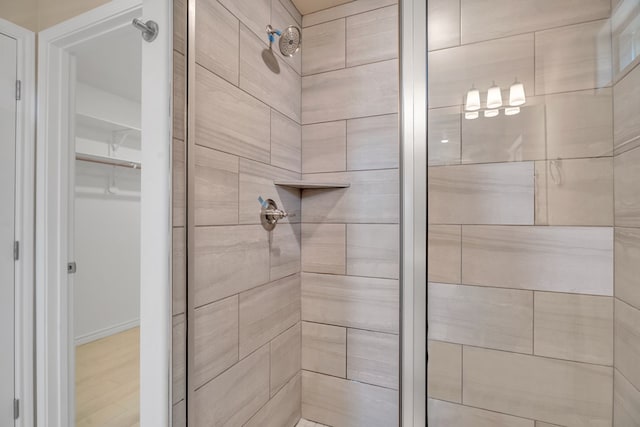 bathroom with a tile shower