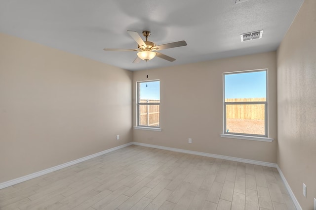 unfurnished room featuring ceiling fan and light hardwood / wood-style flooring