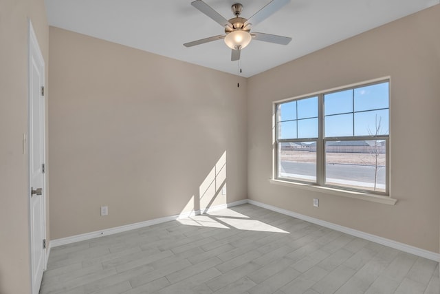 unfurnished room featuring ceiling fan and light hardwood / wood-style floors