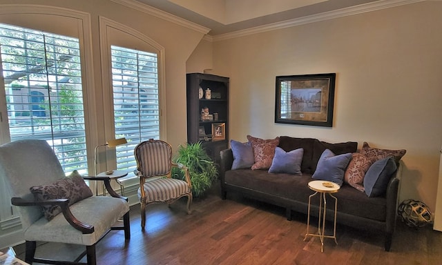 living room with dark wood-type flooring and ornamental molding