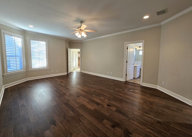 empty room featuring dark hardwood / wood-style flooring, ceiling fan, and crown molding