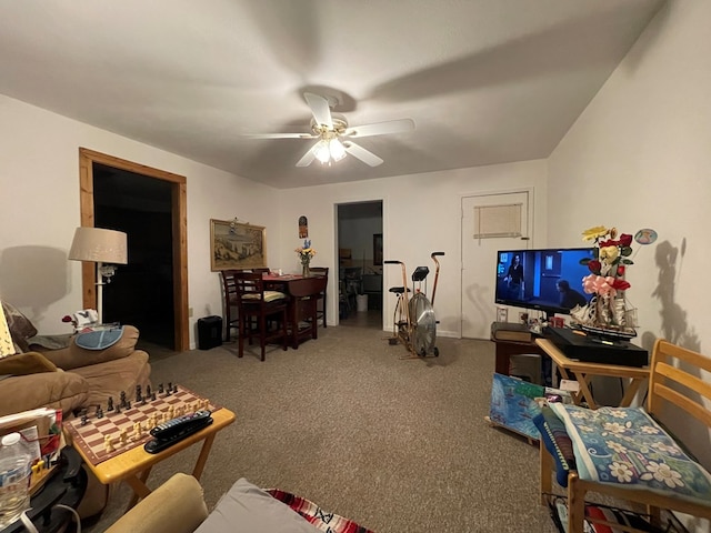 living room featuring carpet flooring and a ceiling fan