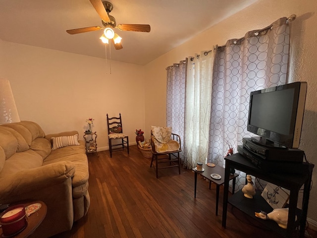 living area with wood-type flooring, baseboards, and a ceiling fan