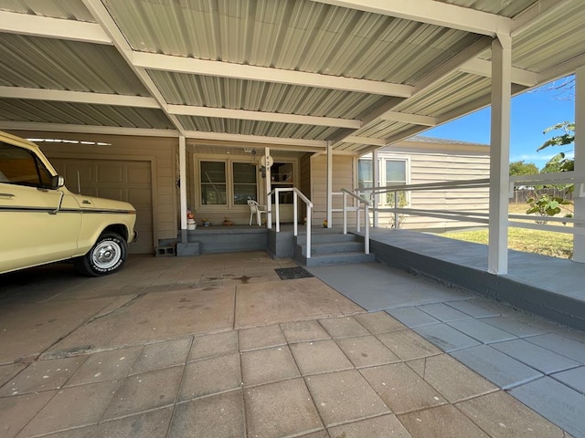 view of exterior entry with a carport