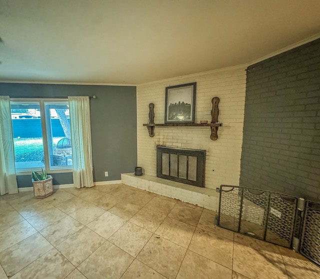 unfurnished living room featuring tile patterned flooring, a brick fireplace, crown molding, and brick wall