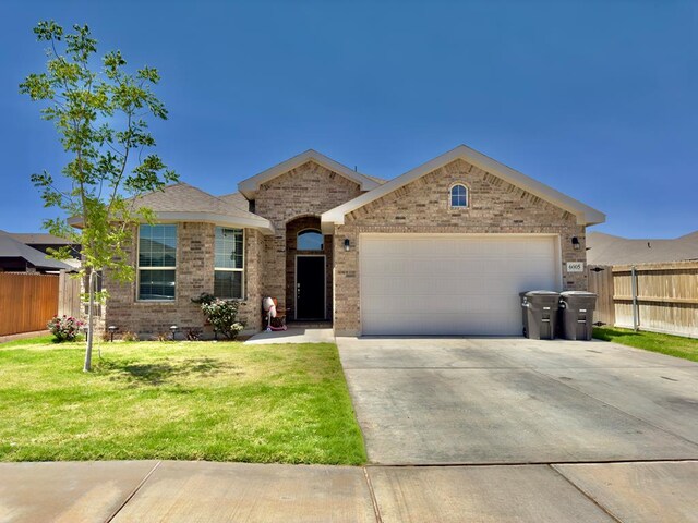 6005 Scaled Quail Rd, Midland, TX 79707 - ranch-style house featuring a garage, concrete driveway, and brick siding