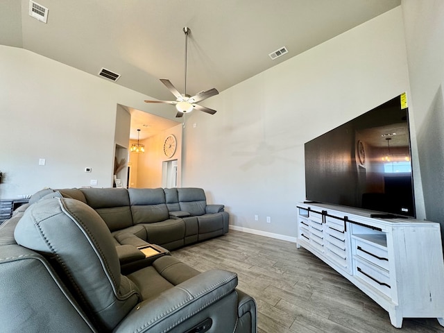 6005 Scaled Quail Rd, Midland, TX 79707 - living room featuring wood finished floors, ceiling fan, baseboards, and vaulted ceiling