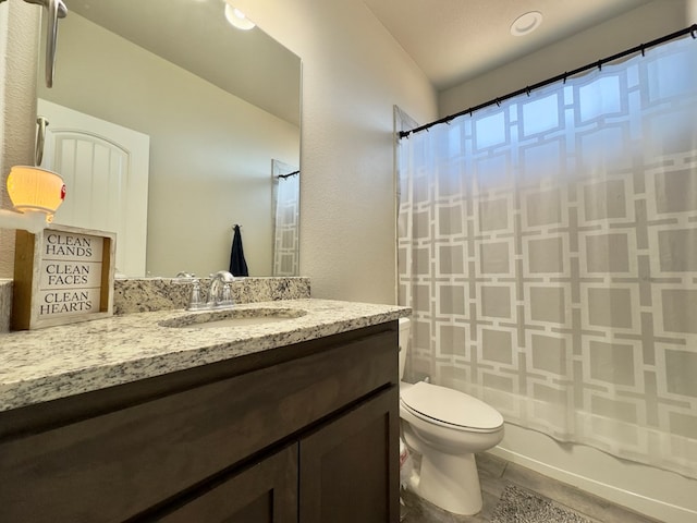 6005 Scaled Quail Rd, Midland, TX 79707 - bathroom featuring toilet, vanity, and shower / tub combo with curtain