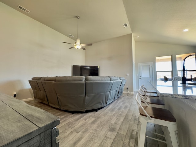 6005 Scaled Quail Rd, Midland, TX 79707 - living room with light wood-type flooring, vaulted ceiling, baseboards, a ceiling fan, and recessed lighting