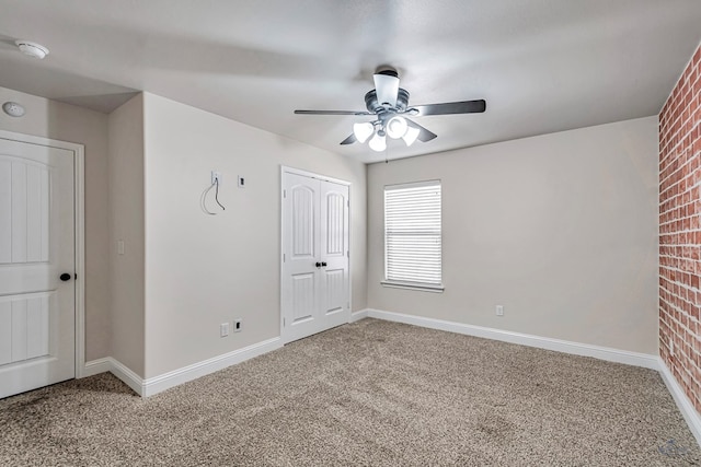 unfurnished bedroom with carpet flooring, a closet, and ceiling fan