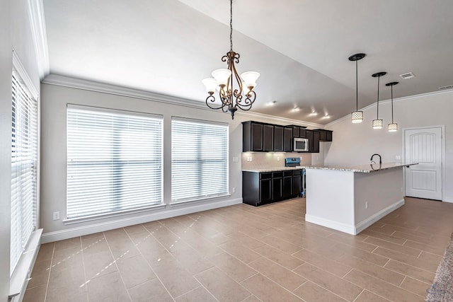 kitchen with hanging light fixtures, a chandelier, vaulted ceiling, and ornamental molding