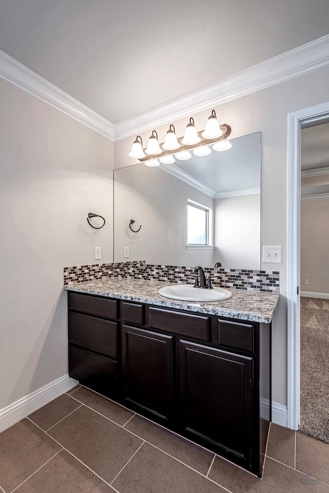 bathroom with decorative backsplash, crown molding, vanity, and tile patterned flooring