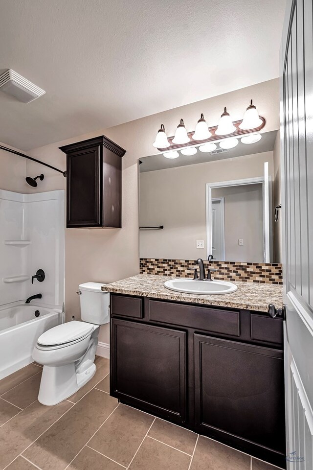 full bathroom with vanity, a textured ceiling, shower / tub combination, tile patterned flooring, and toilet