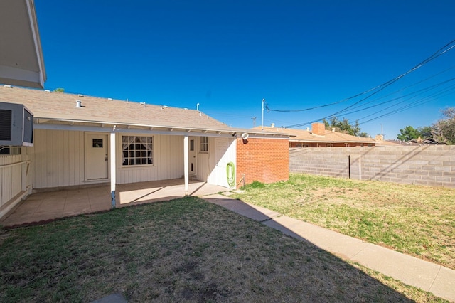 view of yard featuring a patio and fence