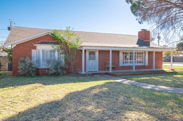 single story home with a front lawn, a chimney, a shingled roof, and brick siding