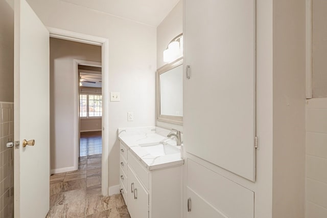 bathroom featuring vanity and baseboards