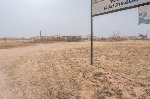 view of yard with a rural view